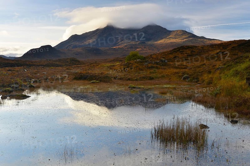 Small lake in front of the Black Cullins Mountains