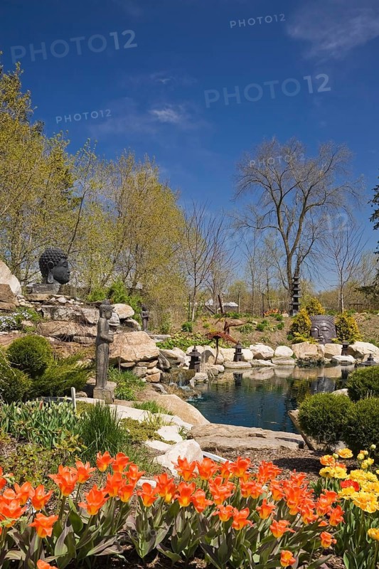 The ornamental pond in the Zen garden at springtime in the 'Route des Gerbes d'Angelica' garden in Mirabel