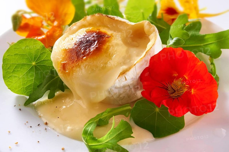Fresh nasturtium flowers and leaves with goats cheese
