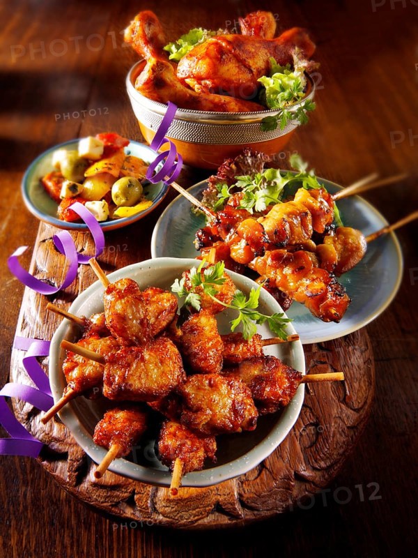 Oriental party buffet food with chicken satay