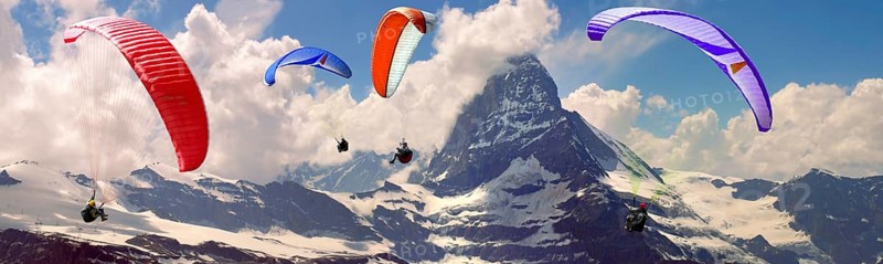 Paragliders over the Matterhorn mountain peak