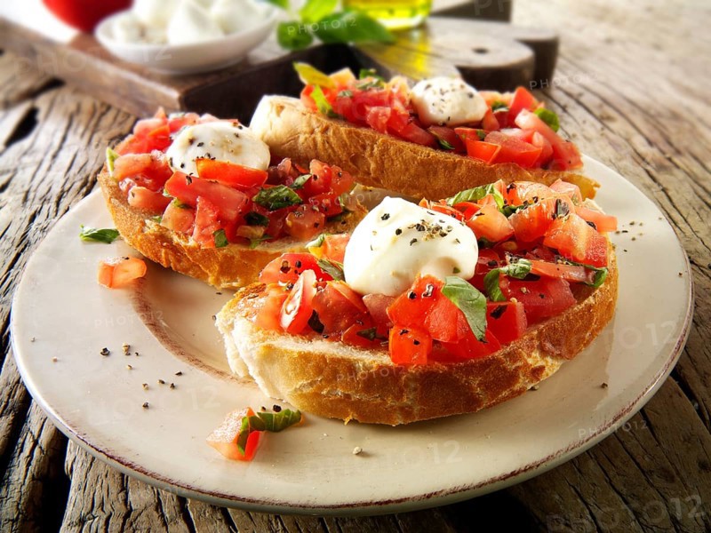 Fresh chopped beefsteak tomato with mini mozzarellas bruschettas