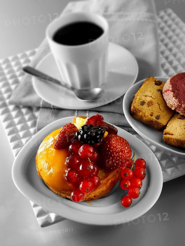 A modern fruit cake with redcurrants