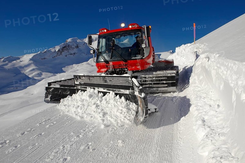 Snow groomer in winter in the mountains near Grindelwald First