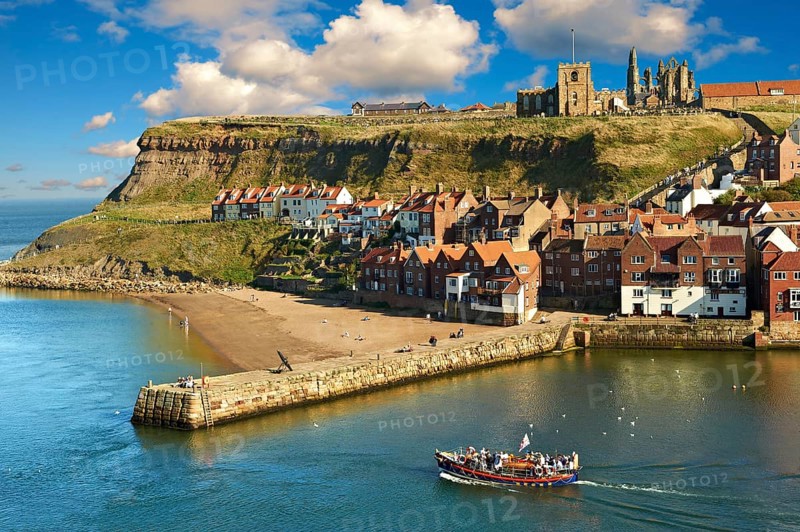 Whitby harbour with Whitby Abbey on the headland