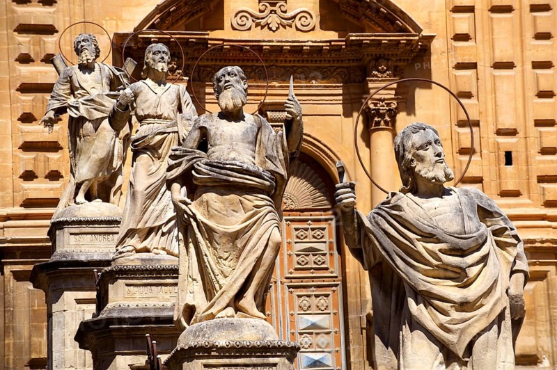 Sculptures in front of baroque Cathedral of Modica