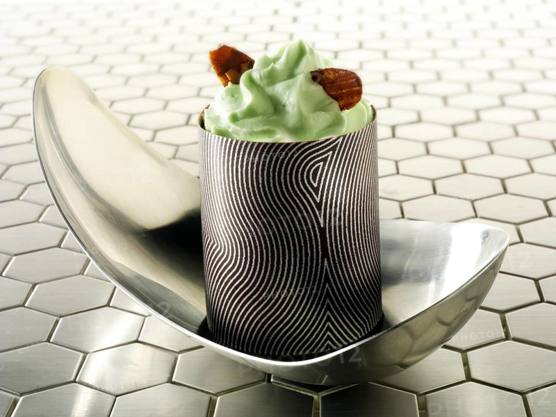 A modern Japanese cake with a patterned chocolate case and mint cream