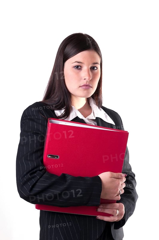 Businesswoman holding a red folder in her arm