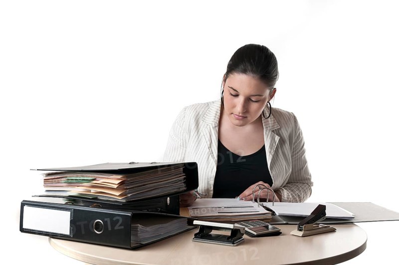 Office worker at a desk with files