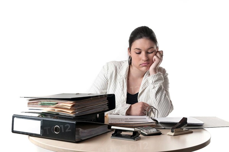 Office worker at a desk with files