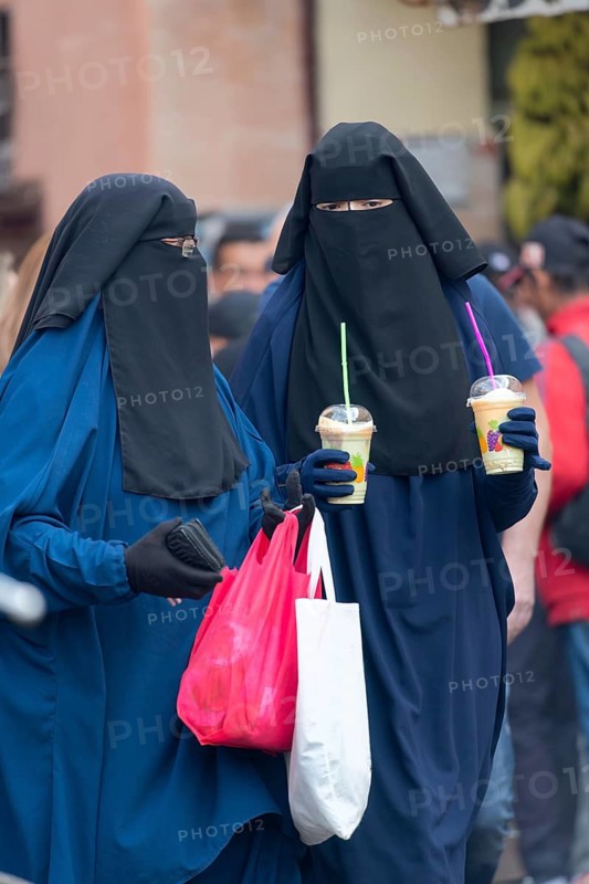 Veiled women on a shopping spree