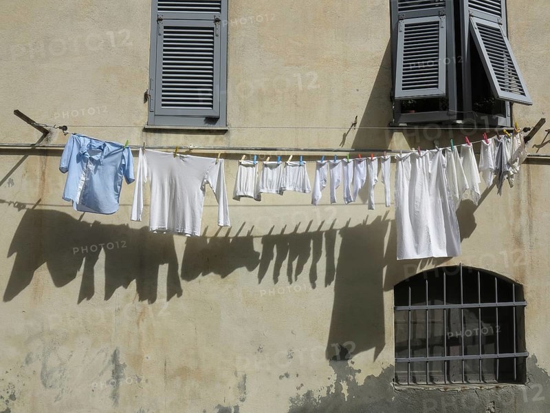 Laundry hanging on a clothesline on a facade
