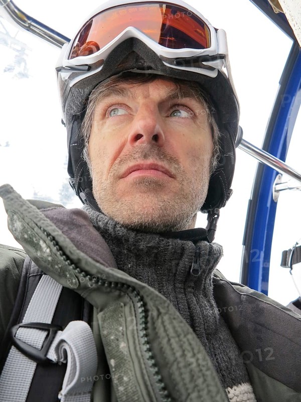 Skiers during a gondola ride in St. Anton am Arlberg