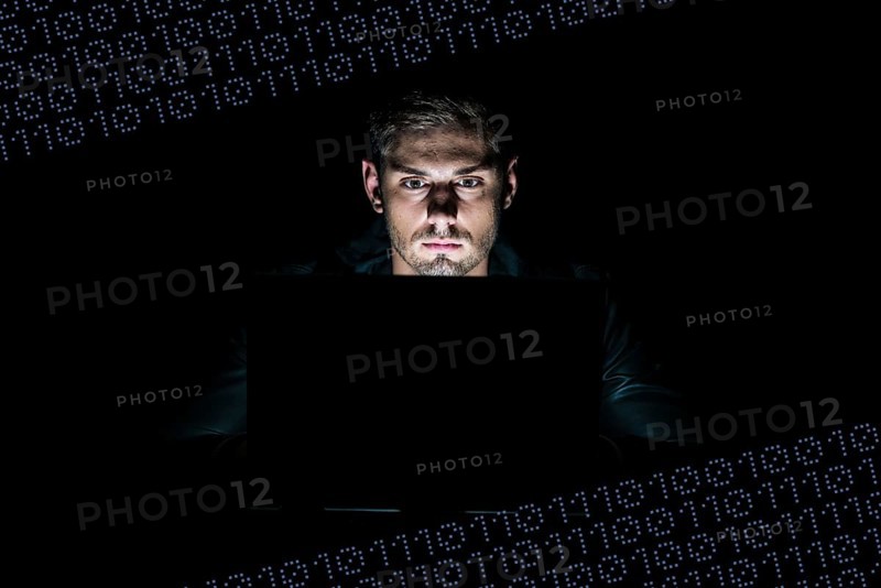 Young man sitting at a computer