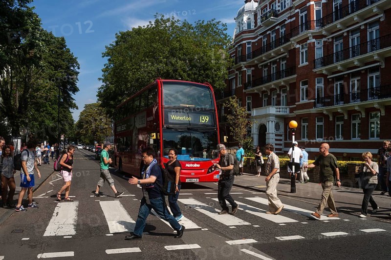 Tourists on the zebra crossing of the famous Beatles album cover