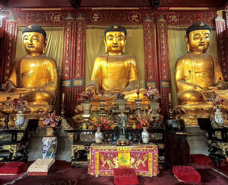 Three Buddha statues