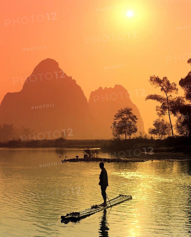 Fisherman on a bamboo raft on the Li Jiang River
