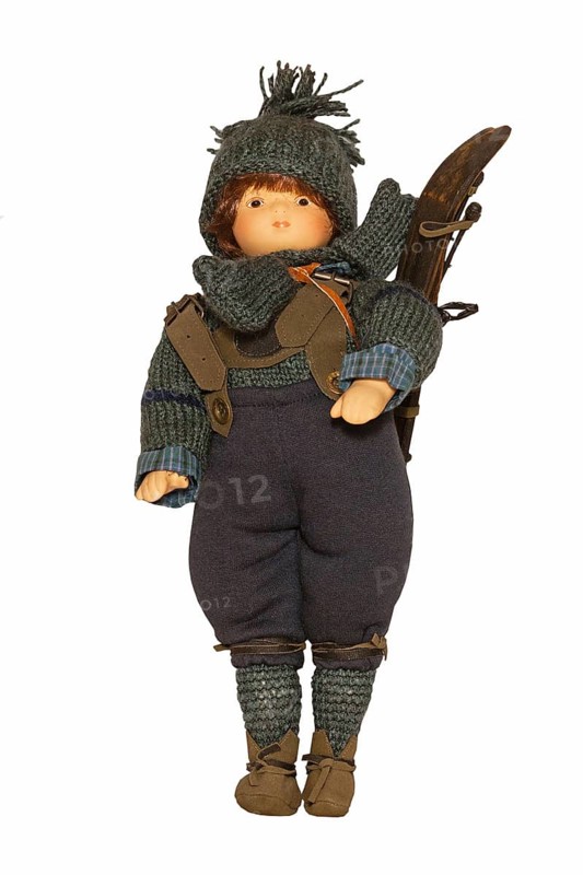 Doll with historical ski clothing and skis