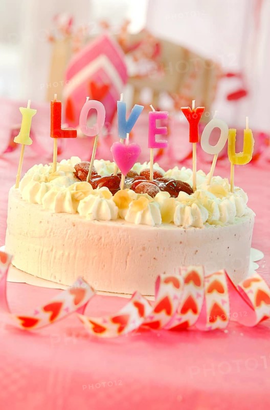 Cake with letter candles spelling the message I love you
