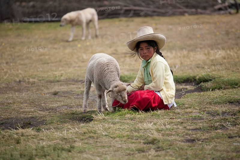 Peruvian shepherd girl with a straw hat
