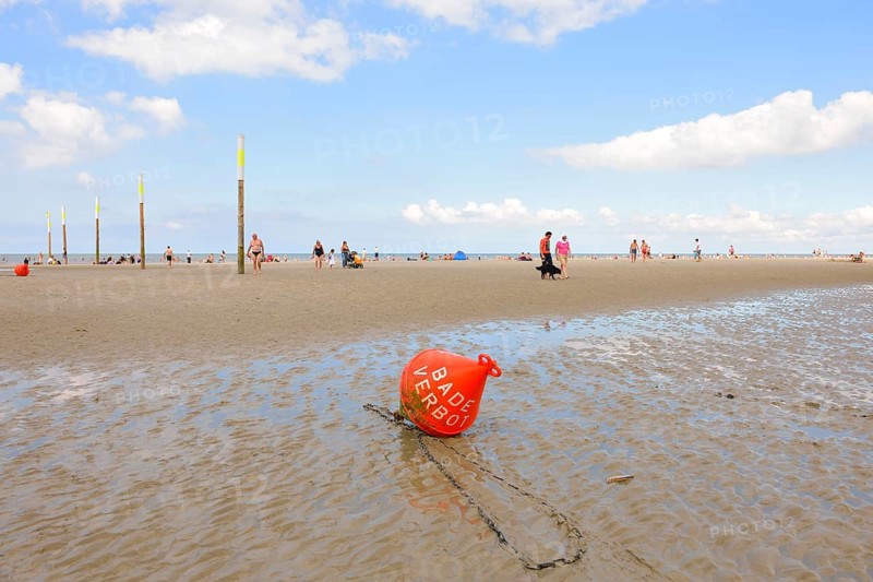 Buoy marked 'Baden Verboten' or 'No Swimming' on the beach of St. Peter-Ording