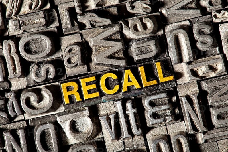 Old lead letters forming the word RECALL
