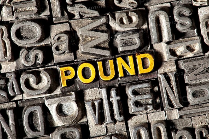 Old lead letters forming the word "POUND"