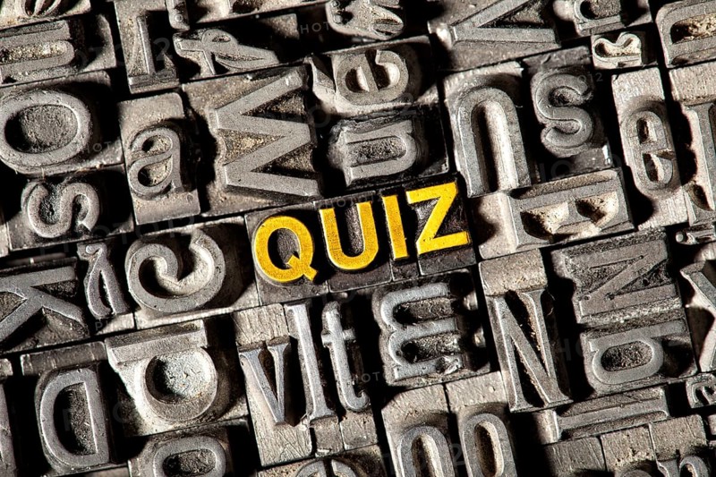 Old lead letters forming the word 'QUIZ'