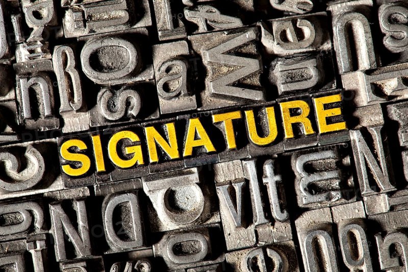 Old lead letters forming the word 'SIGNATURE'