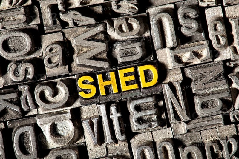 Old lead letters forming the word "SHED"