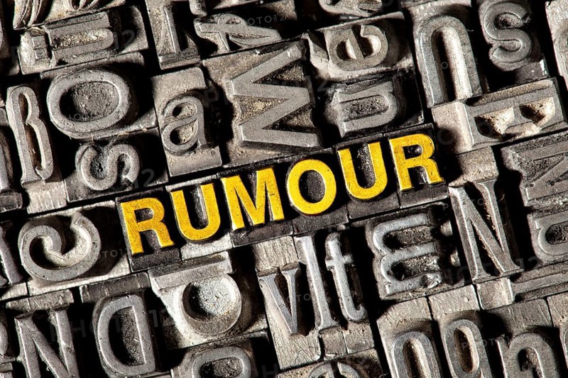 Old lead letters forming the word 'RUMOUR'