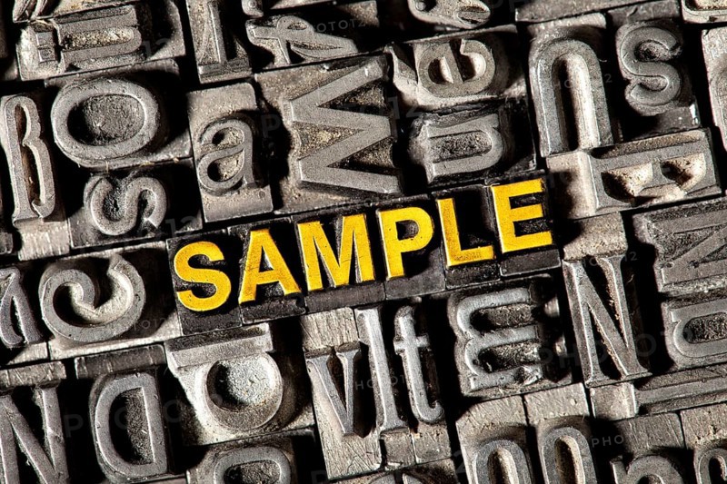 Old lead letters forming the word 'SAMPLE'