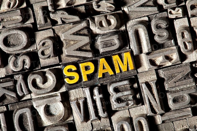 Old lead letters forming the word 'SPAM'