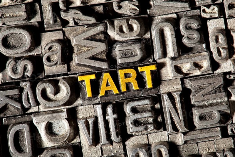Old lead letters forming the word 'TART'
