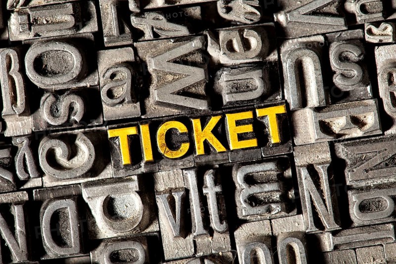 Old lead letters forming the word 'TICKET'