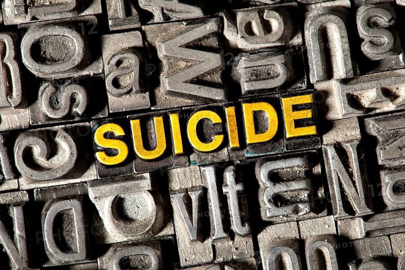 Old lead letters forming the word "SUICIDE"