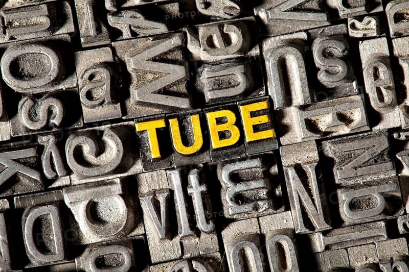 Old lead letters forming the word Tube