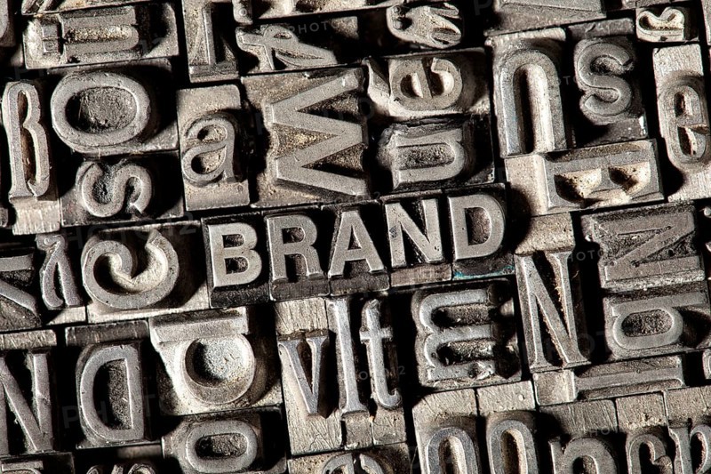Old lead letters forming the word 'BRAND'