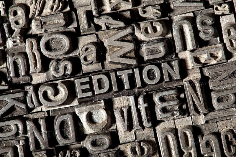 Old lead letters forming the word EDITION