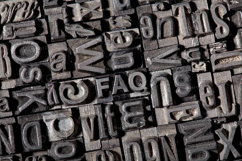 Old lead letters forming the acronym FAQ