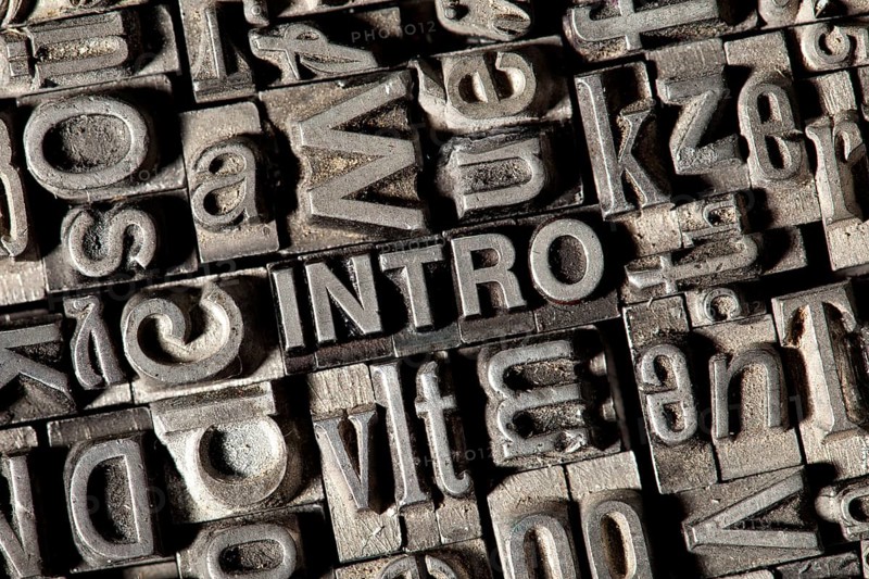 Old lead letters forming the word 'INTRO'