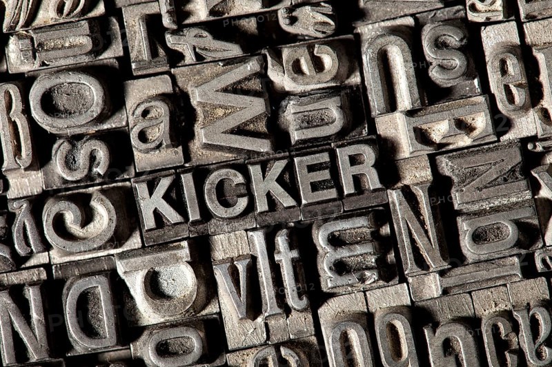 Old lead letters forming the word "KICKER"