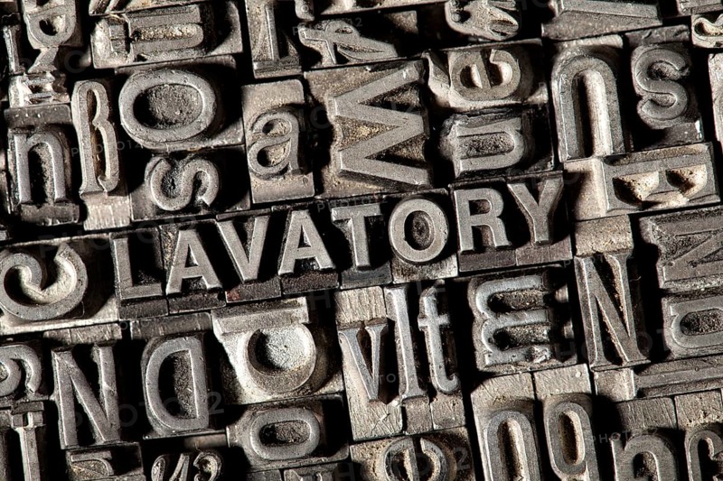 Old lead letters forming the word 'LAVATORY'