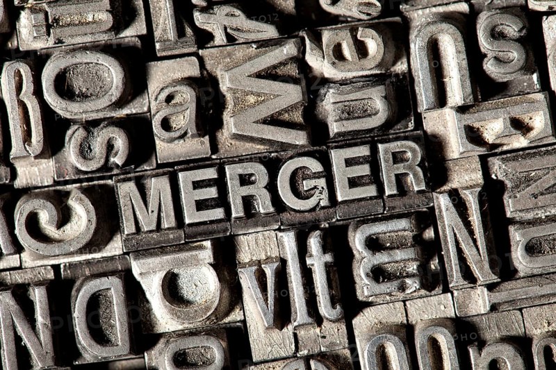 Old lead letters forming the word 'MERGER'