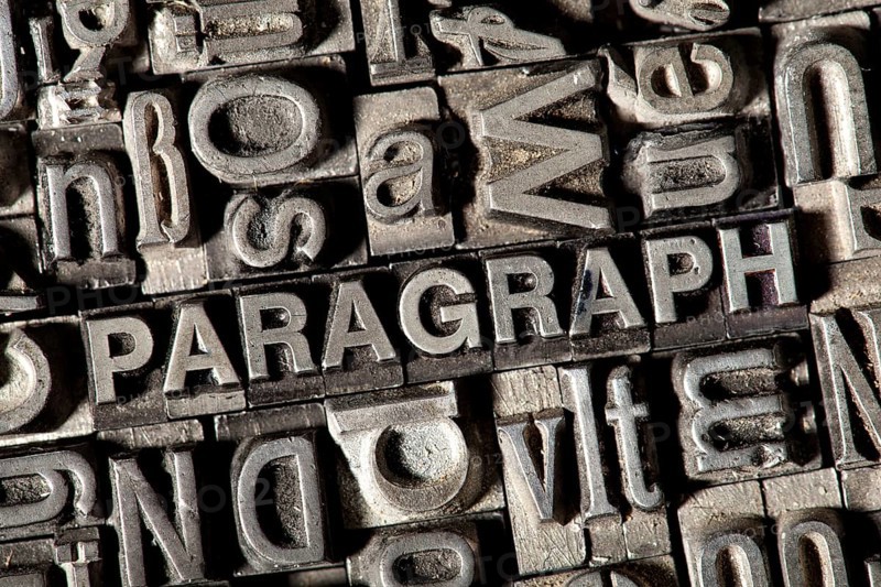 Old lead letters forming the word 'PARAGRAPH'