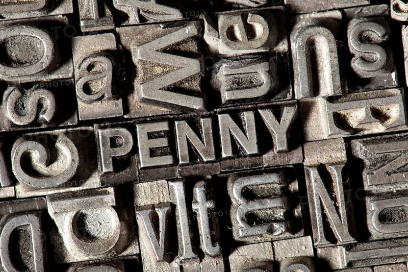 Old lead letters forming the word 'PENNY'