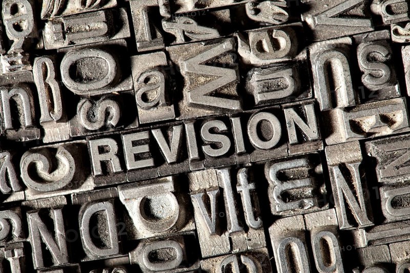 Old lead letters forming the word REVISION