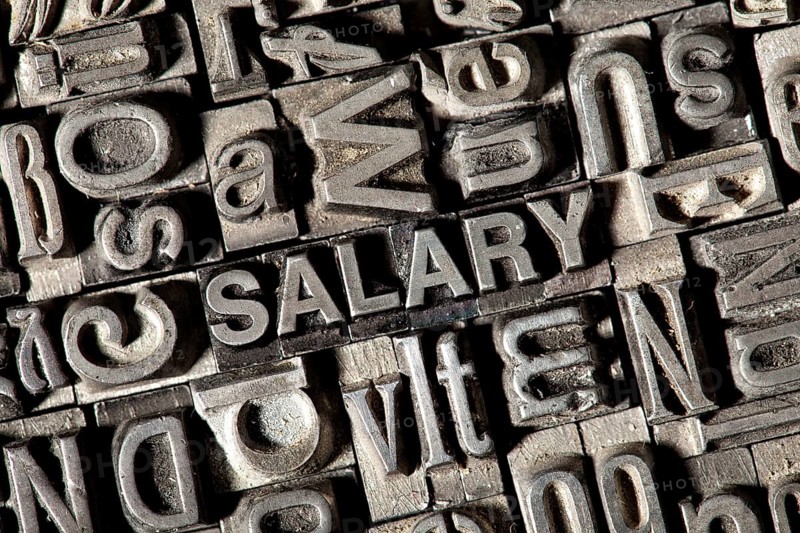 Old lead letters forming the word SALARY
