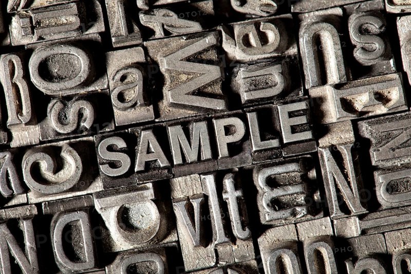 Old lead letters forming the word SAMPLE