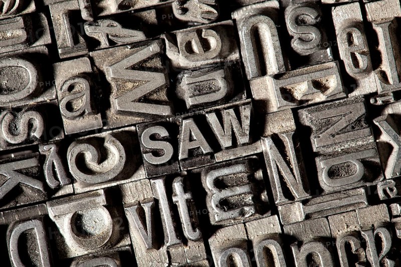 Old lead letters forming the word SAW